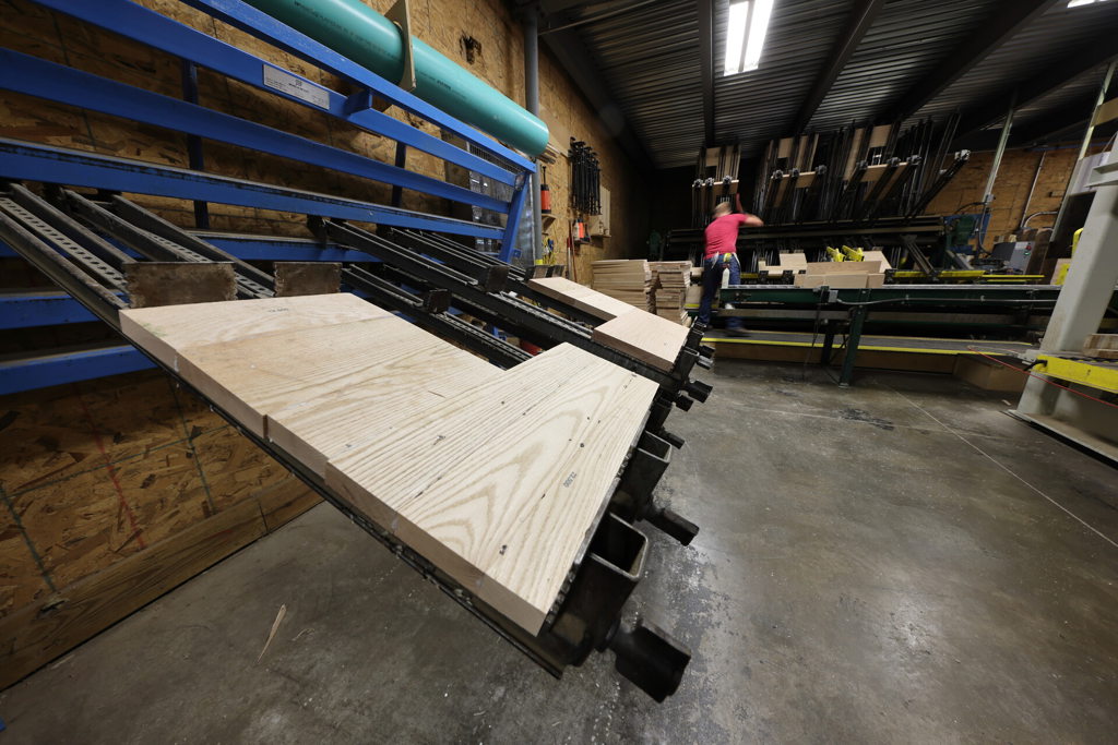 Interior of workshop displaying edge glued panels in variety of sizes